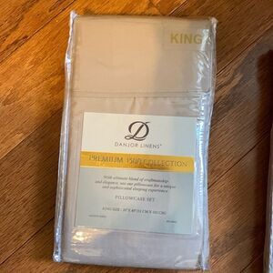 Danjor Linens King-Size pillow case set NEW in package.  Color tan/camel